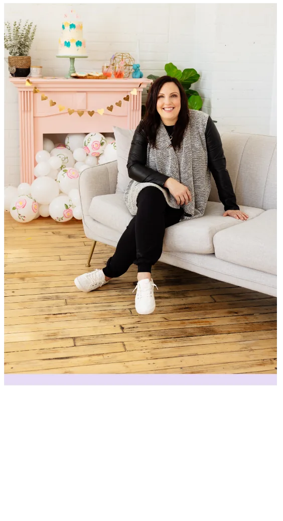 Jenny Porter sitting on a sofa in her balloon studio