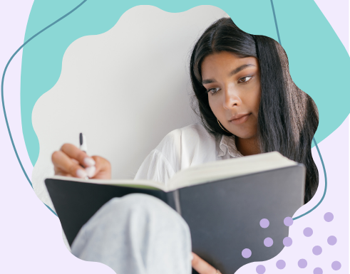 A woman writing in a notebook